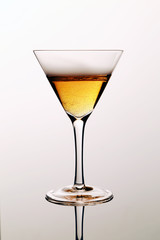 isolated glass of martini with reflection