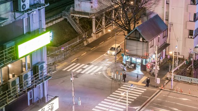 Timelapse of Police Station at Intersection in Tokyo at Night -Tilt Up-