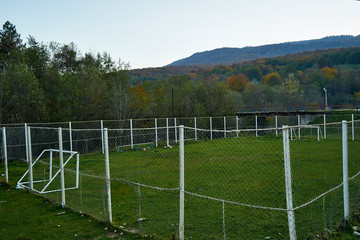 Image of a training football field in a mountain village.