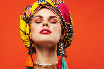 makeup bright african woman in a headdress portrait