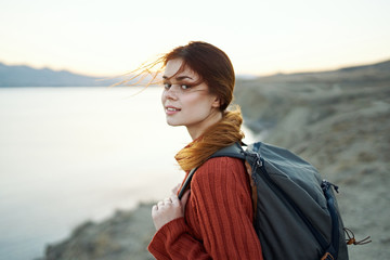 young woman traveling in nature river autumn