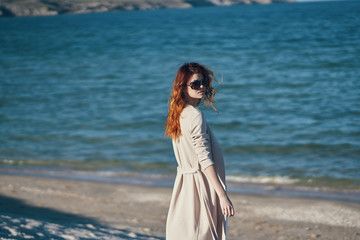 Fototapeta na wymiar woman in glasses by the sea