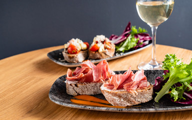 Sandwich with prosciutto, cheese and lettuce