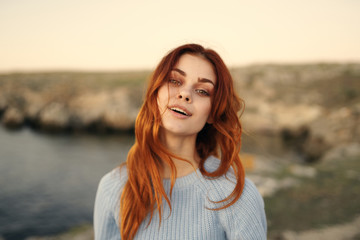 red-haired woman in nature