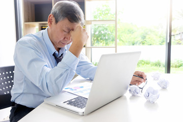 businessman sit at the table fill sad and headache