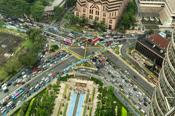 Fototapeta na wymiar Aerial view looking down onto very busy intersection with heavy traffic