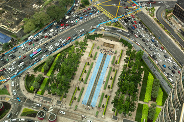 Aerial view looking down onto very busy intersection with heavy traffic