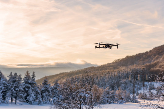 Flying drone like Mavic 2 Pro.