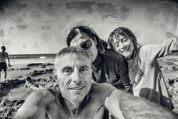 Family of three people happy at Hot Water Beach, Coromandel, New Zealand