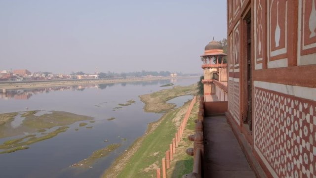 View of the Yamuna river and Agra city beyond as see from the magnificent Tomb of Itimad ud Daulah ka Maqbara, a Mughal mausoleum in Agra, India