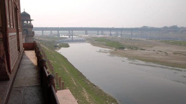 View of the Yamuna river and Agra city beyond as see from the magnificent Tomb of Itimad ud Daulah ka Maqbara, a Mughal mausoleum in Agra, India