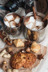 Metal mugs with cacao and marshmallows