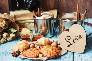 Metal mugs with cacao and marshmallows