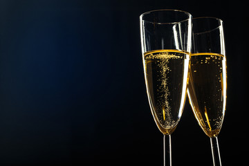 Champagne glasses for festive occasion against a dark background