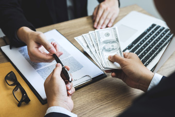 Dishonest cheating in business illegal money, Business man giving bribe money in business people to give success the deal contract of investment, Bribery and corruption concept