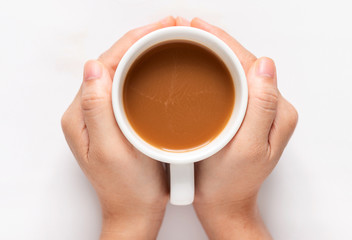 Female hands holding a cup of coffee isolate on white background, top view