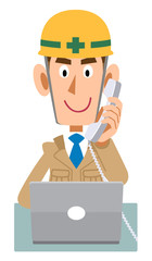 受話器を手に持ちパソコンを操作する建築現場の作業員
