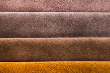 Colorful and bright fabric samples of furniture and clothing upholstery. Close-up of a palette of textile abstract stripes of different colors