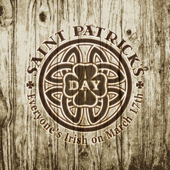 Saint Patrick's day vintage hipster logo design elements on grunge wood texture. Label template for flyer, poster, banner