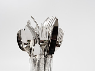 silverware forks spoons knives cutlery on a white background