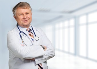 Portrait of  doctor  with arms crossed in medical office