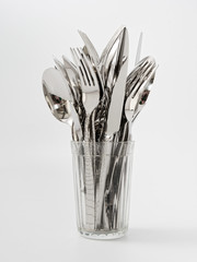 silverware forks spoons knives cutlery on a white background