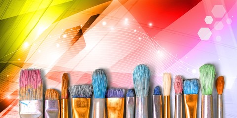 Row of artist paint brushes  on background