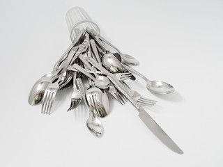 silverware forks spoons knives cutlery on a white background