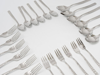 silverware forks spoons knives cutlery on a white background