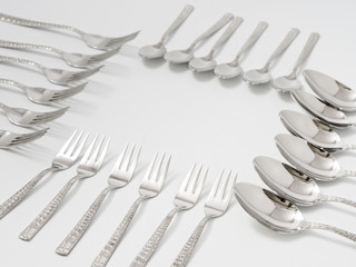 silverware forks spoons knives cutlery on a white background