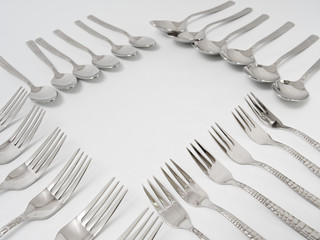 silverware forks spoons knives cutlery on a white background