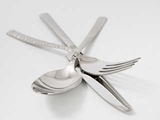 silverware forks spoons knives cutlery on a white background