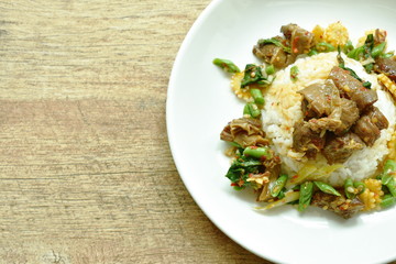 spicy stir fried braised pork with basil leaf on rice