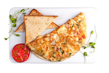 Omelette with ham and cheese. Top view on white background