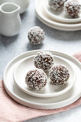 Cacao Date Energy Bites on a white blue background