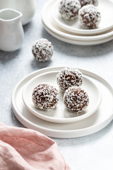 Cacao Date Energy Bites on a white blue background
