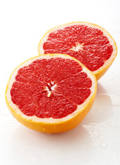 Naklejka na ściany i meble Fresh fruit grapefruit, closeup. On white background
