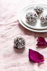 Cacao Date Energy Bites on a white blue background