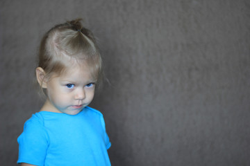 shy little girl looking aside with timidity