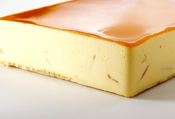 Delicious mango cheesecake on a white background