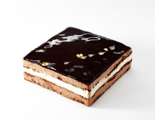 Delicious chocolate cake on a white background