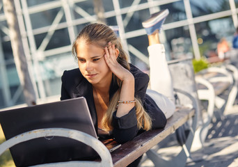 a Young business woman hard working at park