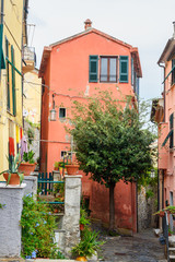 Fototapeta na wymiar Old narrow street in Portovenere or Porto Venere town on Ligurian coast. Italy