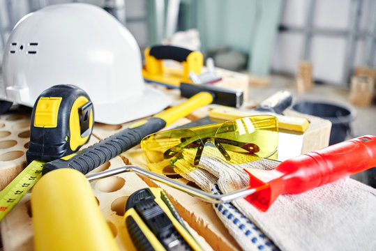 Home repairs. Construction tools, bricks and helmet