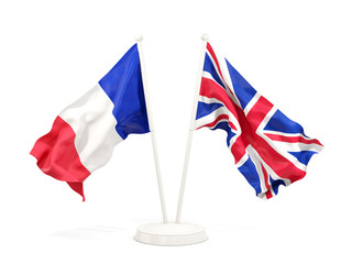 Two waving flags of France and UK