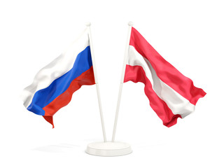 Two waving flags of Russia and austria