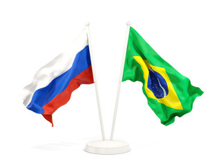 Two waving flags of Russia and brazil