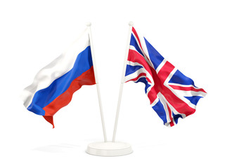 Two waving flags of Russia and UK