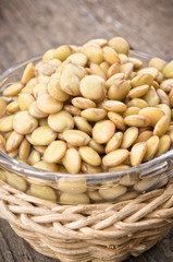 Raw lentils on wooden table with copy space