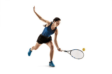 Full length portrait of young woman playing tennis isolated on white background. Healthy lifestyle. The practicing, fitness, sport, exercise concept. The female model in motion or movement